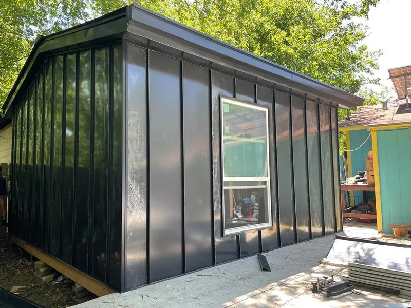 Black standing seam metal wall panels for Roof Inspection in Homestead Meadows North