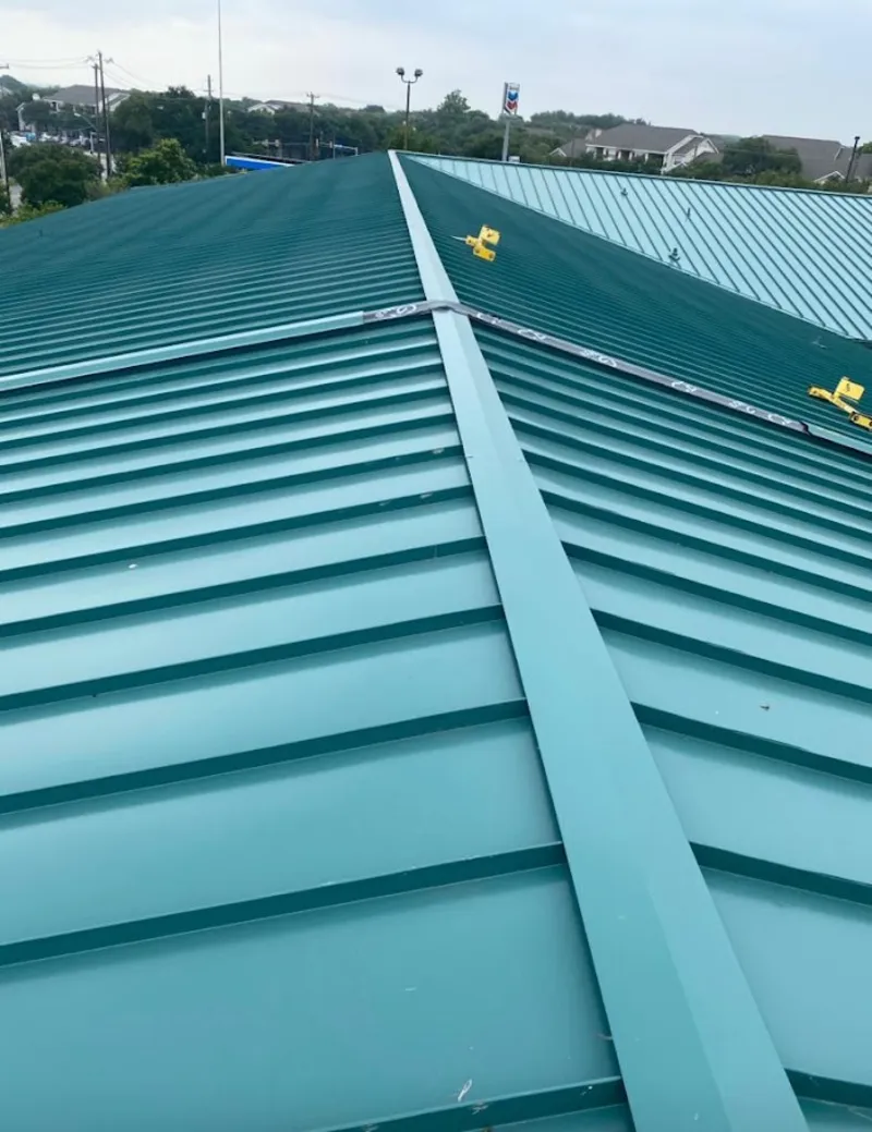 Green commercial metal roof ridge and valley for Metal Roof Repair in Homestead Meadows North